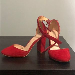 Red suede heels.
